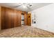 Bedroom featuring wood paneling and convenient closet space at 2434 S Ogden St # 2434-2436, Denver, CO 80210