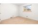 This bedroom offers ample sunlight through its window and features neutral carpet at 2434 S Ogden St # 2434-2436, Denver, CO 80210
