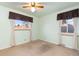 Cozy bedroom featuring a ceiling fan and two windows that provide plenty of natural light at 2434 S Ogden St # 2434-2436, Denver, CO 80210