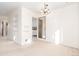 This dining room has an open space with built in shelves and a doorway view of the kitchen at 2434 S Ogden St # 2434-2436, Denver, CO 80210