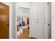 An inviting entryway with hardwood floors, a coat closet and an open view to the living room at 2434 S Ogden St # 2434-2436, Denver, CO 80210