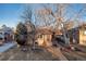 Inviting brick home with a well-maintained lawn and mature trees providing ample shade at 2434 S Ogden St # 2434-2436, Denver, CO 80210