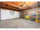 Garage space featuring an overhead door and shelving units at 2434 S Ogden St # 2434-2436, Denver, CO 80210