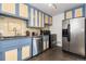 Stylish kitchen featuring blue cabinets, stainless steel appliances and an undermount sink at 2434 S Ogden St # 2434-2436, Denver, CO 80210