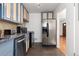 Modern kitchen featuring stainless steel appliances, granite countertops, and stylish cabinetry at 2434 S Ogden St # 2434-2436, Denver, CO 80210