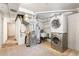 Basement laundry area with stacked washer/dryer and utility sink at 2434 S Ogden St # 2434-2436, Denver, CO 80210