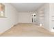Spacious living room featuring neutral carpet and a large window at 2434 S Ogden St # 2434-2436, Denver, CO 80210