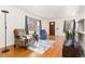 Bright living room with hardwood floors, large windows, and comfortable seating arrangement at 2434 S Ogden St # 2434-2436, Denver, CO 80210