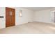 Inviting living room with a large front door, natural light, and a neutral color palette at 2434 S Ogden St # 2434-2436, Denver, CO 80210