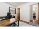 A bright office space with a wooden desk, comfortable chair, and natural light from the window at 2434 S Ogden St # 2434-2436, Denver, CO 80210