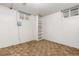 Unfinished room with carpet, white walls, and built-in shelving at 2434 S Ogden St # 2434-2436, Denver, CO 80210