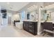Bright bathroom with a modern soaking tub, stylish vanity, and contemporary lighting fixtures at 2540 Xavier St, Denver, CO 80212