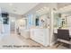 Bright bathroom with a modern soaking tub, stylish vanity, and contemporary lighting fixtures at 2540 Xavier St, Denver, CO 80212