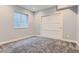 Basement bedroom with egress window and closet providing natural light and functionality at 2540 Xavier St, Denver, CO 80212