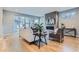 Modern living room featuring a sleek fireplace, large windows, and stylish decor at 2540 Xavier St, Denver, CO 80212