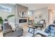 Well-lit living room featuring a sleek fireplace and stylish decor at 2540 Xavier St, Denver, CO 80212