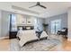 Serene main bedroom suite features a tray ceiling, plush carpet, and a private balcony at 2540 Xavier St, Denver, CO 80212