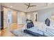 Spacious main bedroom featuring a tray ceiling, plush carpet, and multiple closets at 2540 Xavier St, Denver, CO 80212