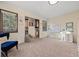 Bedroom featuring built-in closet shelving and desk area, a beanbag chair, and two windows at 33379 Buffalo Park Rd, Evergreen, CO 80439