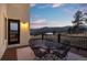 Relaxing deck and outdoor dining with stunning views of the surrounding mountains at 33379 Buffalo Park Rd, Evergreen, CO 80439