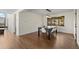 Bright dining room with modern light fixture and views of lush outdoor scenery at 33379 Buffalo Park Rd, Evergreen, CO 80439