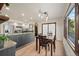 Eat-in kitchen area with table and chairs plus stainless steel appliances and light countertops at 33379 Buffalo Park Rd, Evergreen, CO 80439