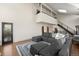 Spacious living room featuring a modern staircase, high ceilings, and ample seating at 33379 Buffalo Park Rd, Evergreen, CO 80439