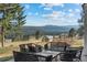 Outdoor seating area with mountain views perfect for enjoying the natural scenery at 33379 Buffalo Park Rd, Evergreen, CO 80439