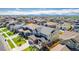 Panoramic aerial view of a residential neighborhood, with modern homes, manicured lawns, and mountain views in the distance at 12941 Delaware St, Westminster, CO 80234