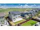 Aerial shot of backyard featuring a well-maintained lawn, a concrete patio, privacy fencing, and tasteful landscaping at 12941 Delaware St, Westminster, CO 80234