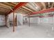 Spacious unfinished basement with exposed beams, concrete floors, and ample space for customization at 12941 Delaware St, Westminster, CO 80234