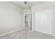 Neutral bedroom with a ceiling fan, closet, and doorway with carpet flooring at 12941 Delaware St, Westminster, CO 80234