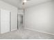 Neutral bedroom with a ceiling fan, closet, and doorway with carpet flooring at 12941 Delaware St, Westminster, CO 80234