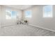 Bright bedroom with two windows and neutral tones offer a relaxing personal space at 12941 Delaware St, Westminster, CO 80234