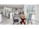 Cozy dining area featuring a round table and chairs with access to the kitchen at 12941 Delaware St, Westminster, CO 80234