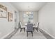 Cozy dining room with a round table, chandelier, and neutral color scheme at 12941 Delaware St, Westminster, CO 80234