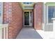 Charming brick home entrance with a decorative wreath on the front door at 12941 Delaware St, Westminster, CO 80234