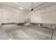 Spacious unfinished garage with high ceilings and ample room for vehicles and storage at 12941 Delaware St, Westminster, CO 80234