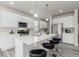 Stylish kitchen featuring a large island, stainless steel appliances, and white cabinets at 12941 Delaware St, Westminster, CO 80234