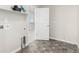 Functional laundry room with modern tile flooring and convenient utility connections at 12941 Delaware St, Westminster, CO 80234