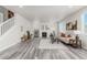 Open living space featuring wood floors, a fireplace, and lots of natural light at 12941 Delaware St, Westminster, CO 80234