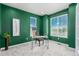 This home office offers plenty of natural light with two large windows and neutral-toned walls at 12941 Delaware St, Westminster, CO 80234