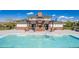 Community pool house with brick accents and pergola, perfect for outdoor relaxation and recreation at 12941 Delaware St, Westminster, CO 80234