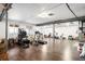 Spacious basement with hardwood floors, featuring workout equipment and potential for customization at 6143 Eldora St, Golden, CO 80403