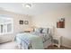 Comfortable bedroom with a queen-sized bed, side tables, and natural light from the window at 6143 Eldora St, Golden, CO 80403