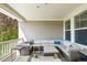Spacious covered deck featuring ample seating and windows, ideal for enjoying the outdoors in any weather at 6143 Eldora St, Golden, CO 80403