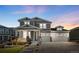 Charming two-story home showcasing a well-maintained exterior, three-car garage, and inviting curb appeal at 6143 Eldora St, Golden, CO 80403