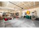 Organized garage space with tools, bikes, and storage solutions on the concrete floor at 6143 Eldora St, Golden, CO 80403