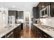Beautiful kitchen with granite countertops, stainless steel appliances, and ample cabinet space at 6143 Eldora St, Golden, CO 80403