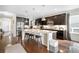 Stylish kitchen with granite countertops, stainless steel appliances, and a spacious island with seating, great for entertaining at 6143 Eldora St, Golden, CO 80403